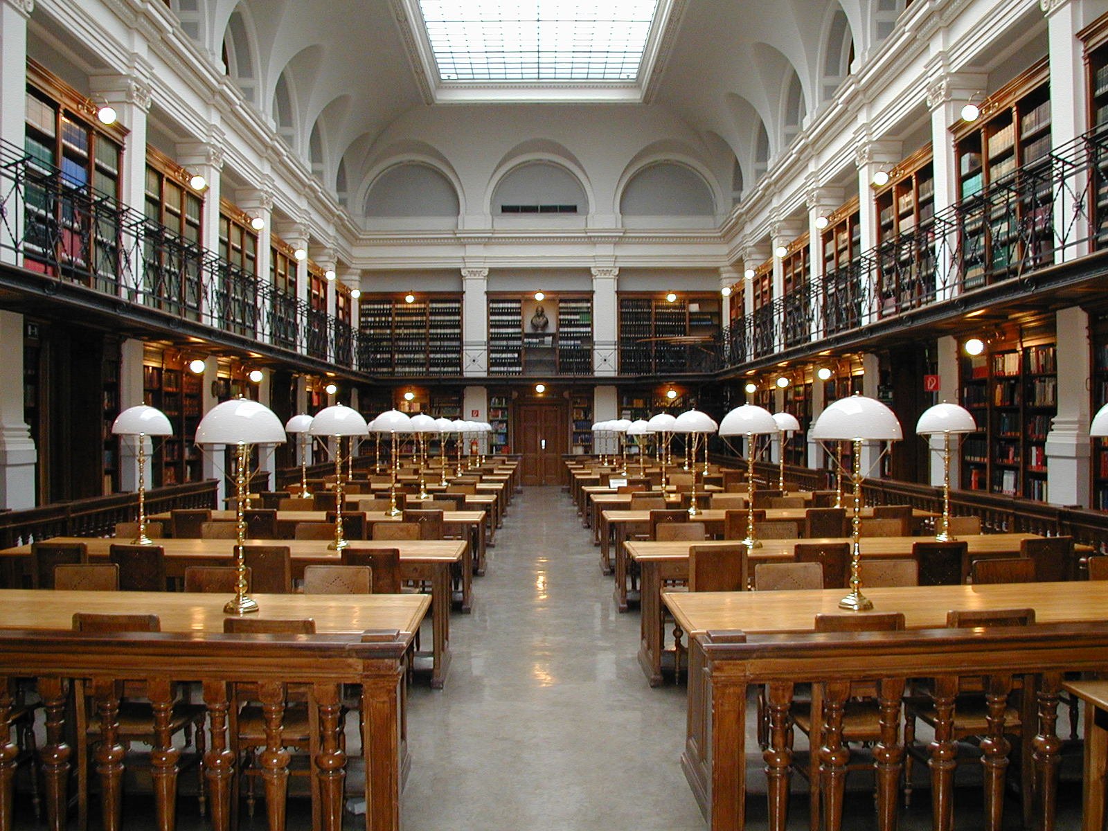 A historic library reading room with rows of green-shaded lamps — song lyrics brought to the page